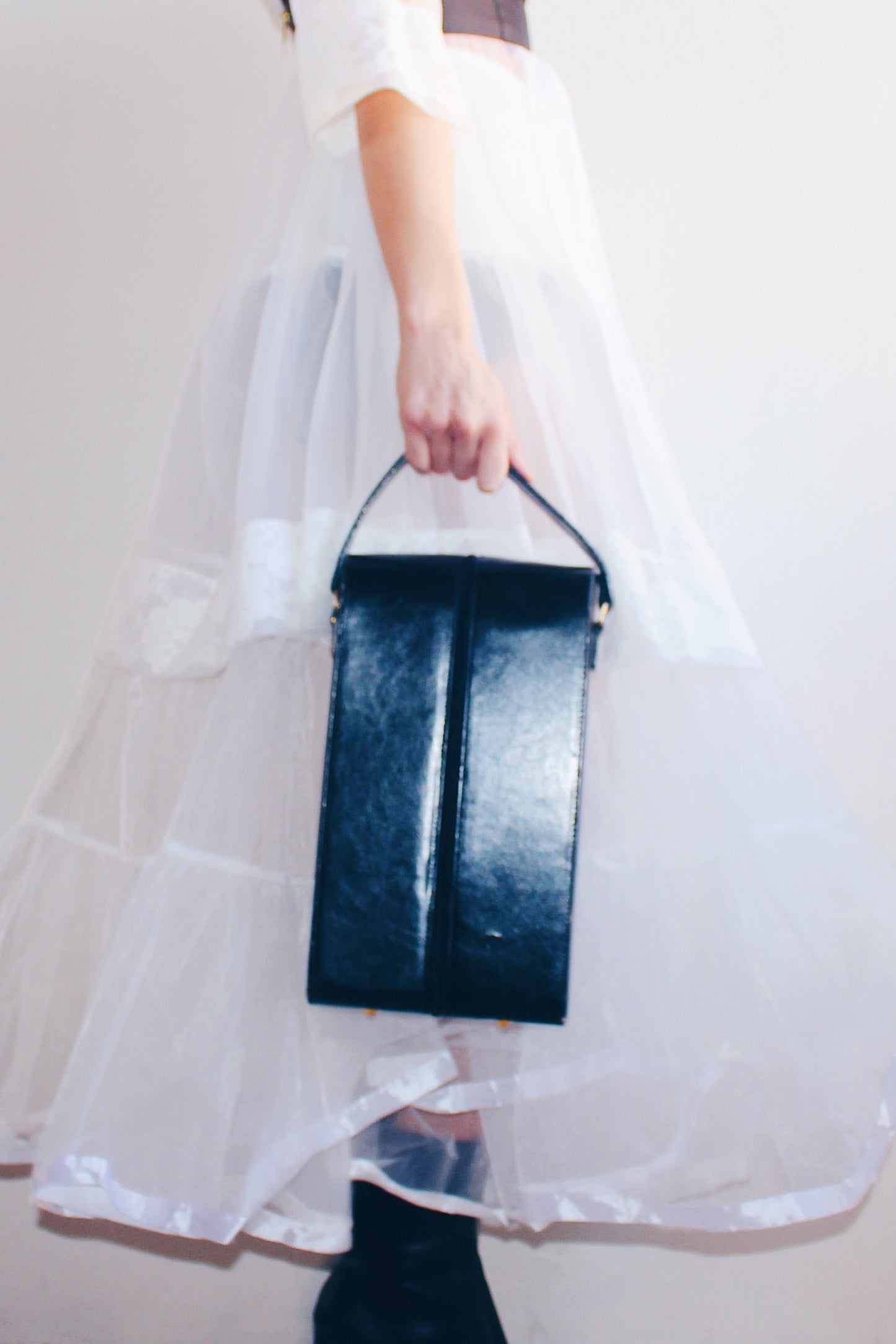 Noir Chic: Black Long Faux Leather Case - Edgy Rectangular Elegance!