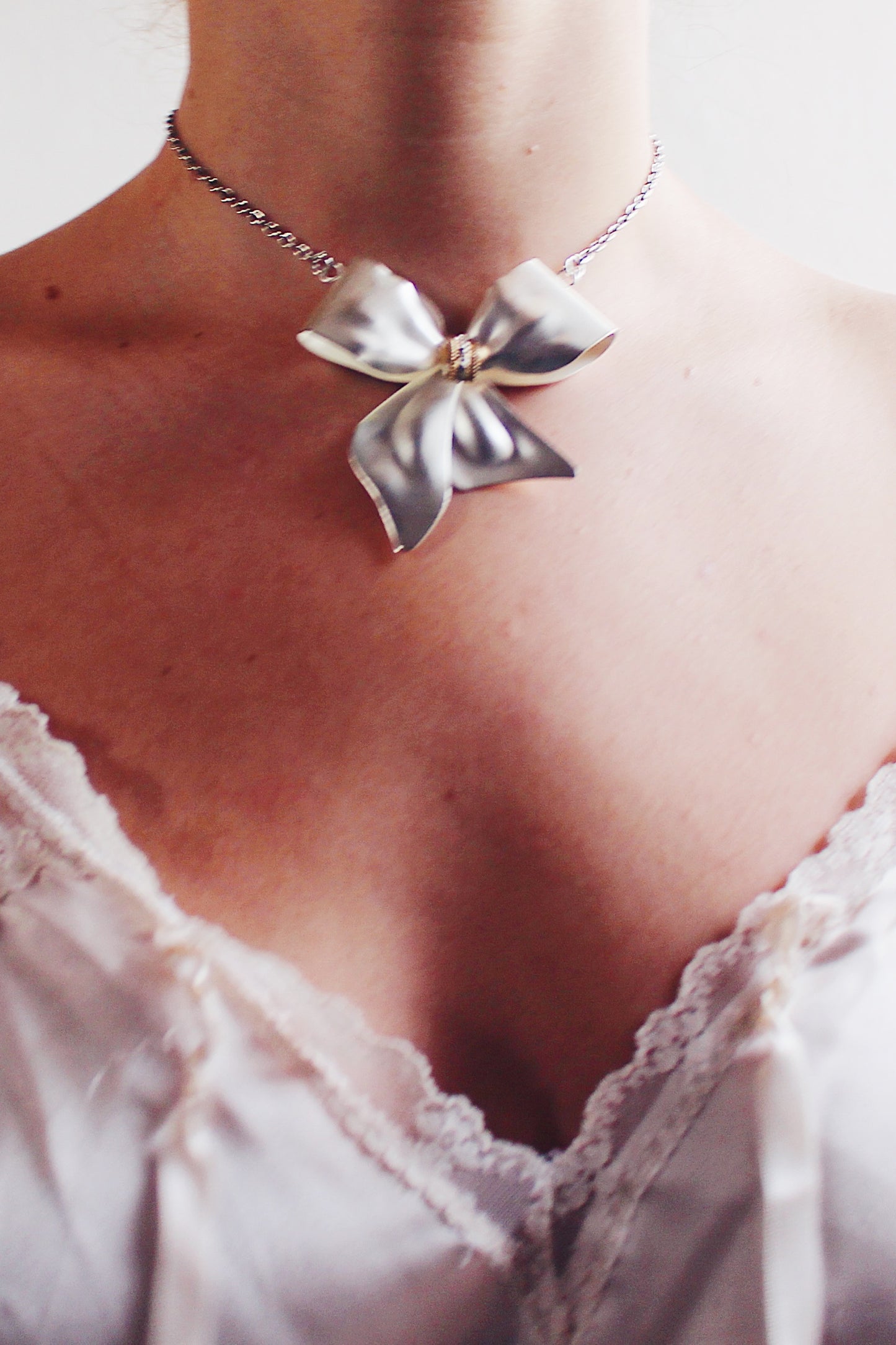 Charming Balletcore: Silver Bow Pendant Necklace for Valentine's
