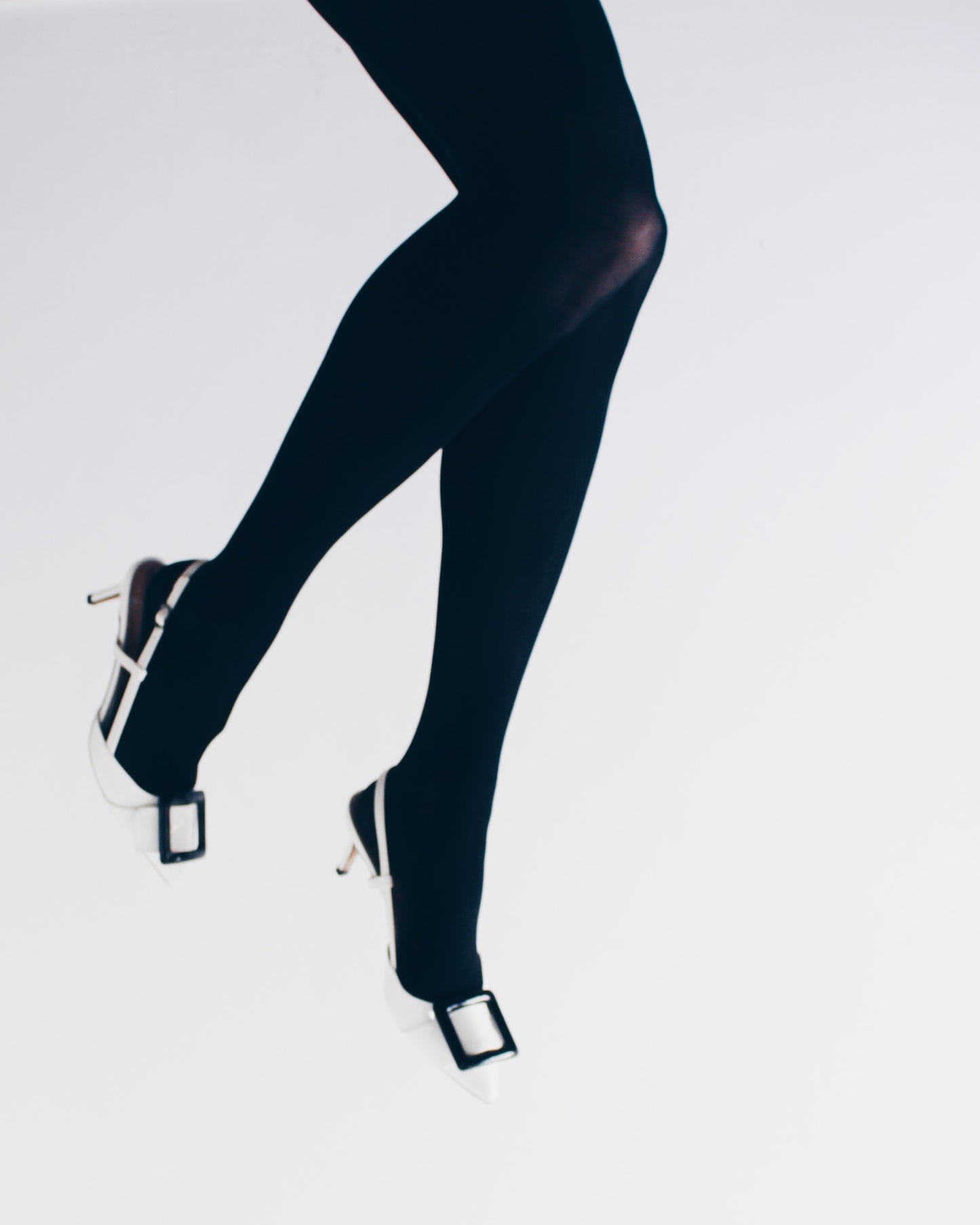 Pointed toe white kitten heal with color block black buckle