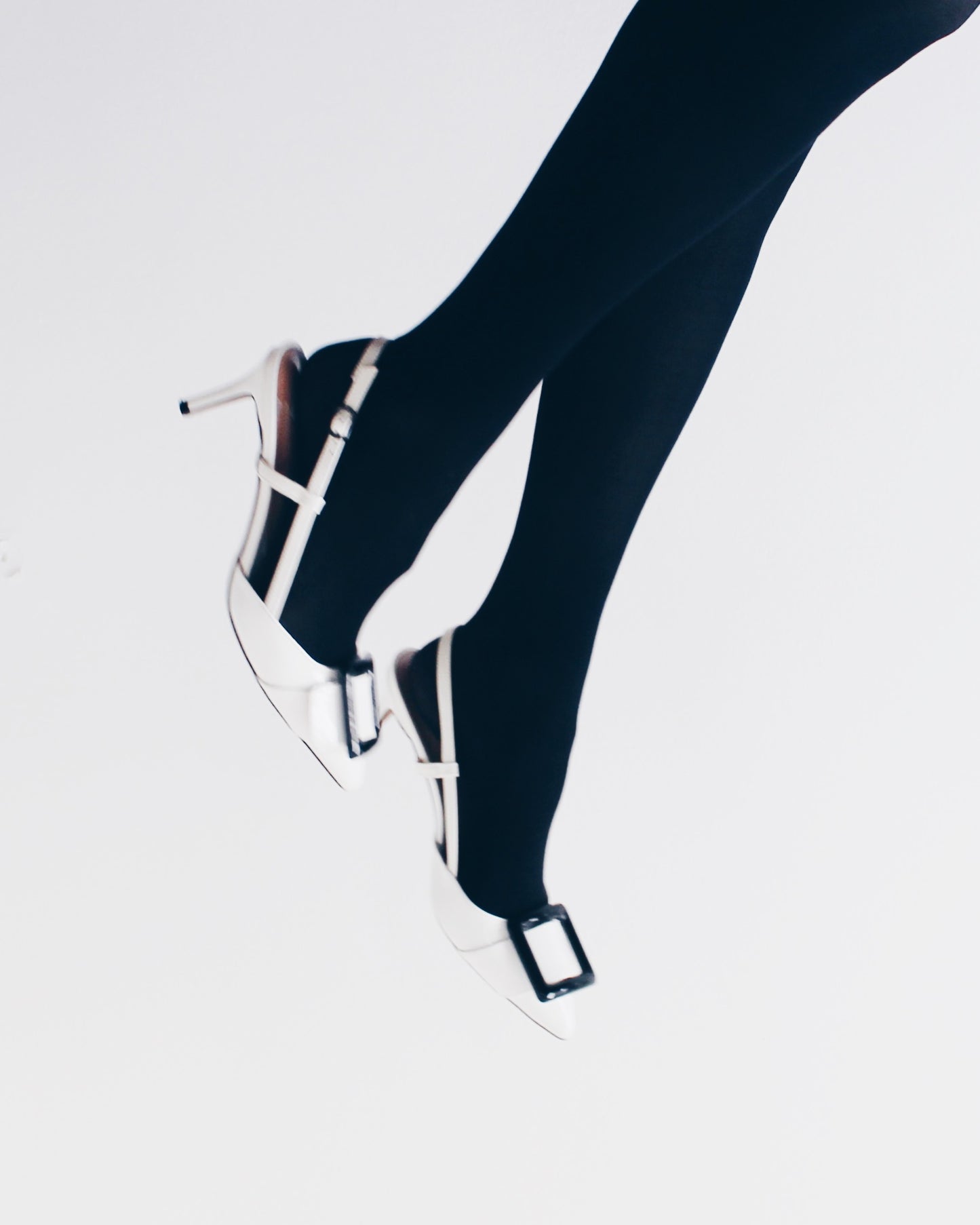Pointed toe white kitten heal with color block black buckle